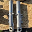 Harley Davidson Lower Fork Sliders Legs R46497-00 L46495-00. Fixed Price $100.00.