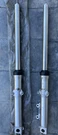 Suzuki GS550E 77-79 Front Forks Pair 51103-47400 51104-47400 N.o.s. Fixed Price $279.00.