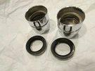 Reconditioned Suzuki 1970-72 TS90 TC90 Fork Nut Set With Nos Seals. Fixed Price $69.99.